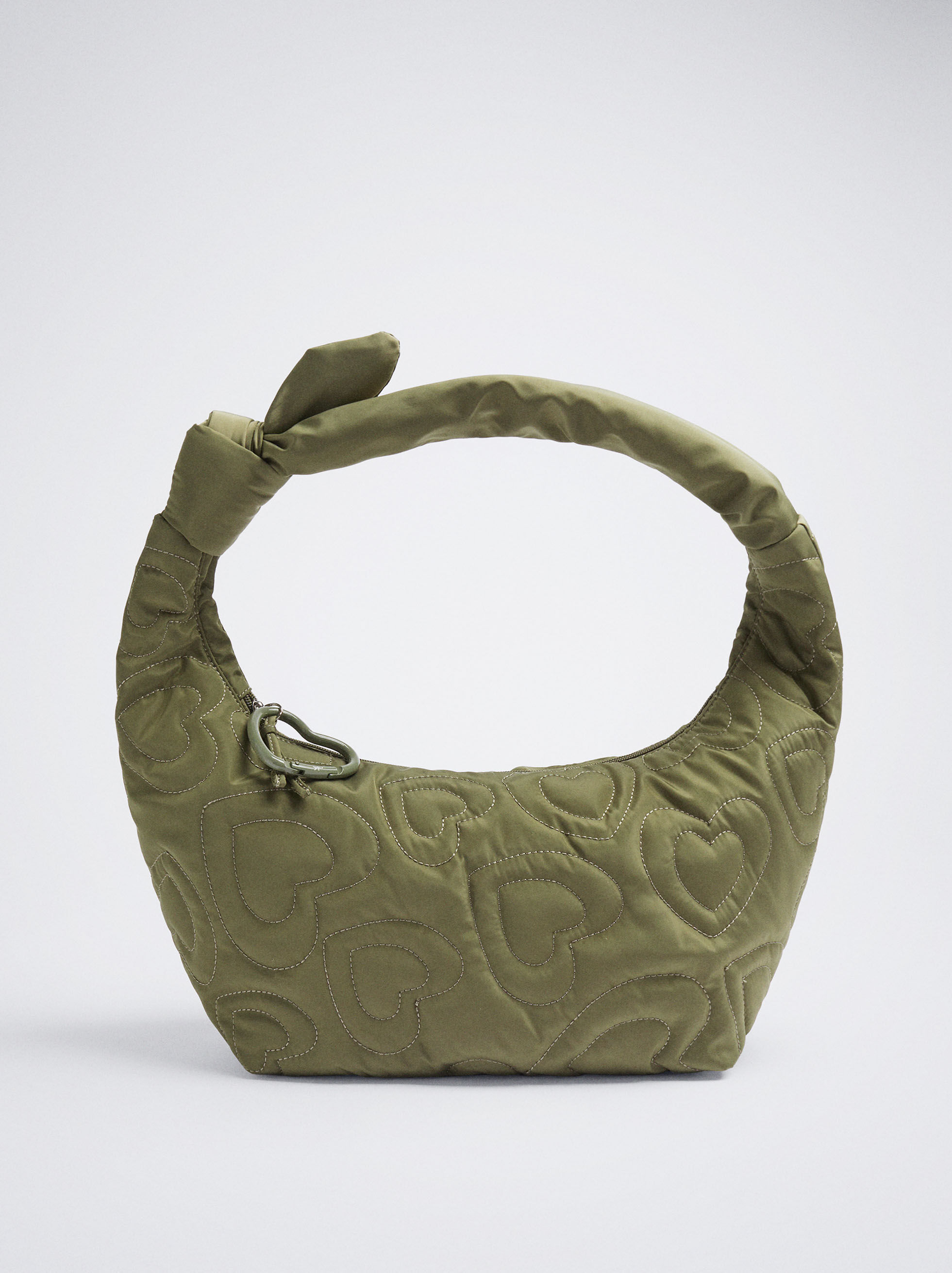 Sac à bandoulière avec coutures cœur vert.